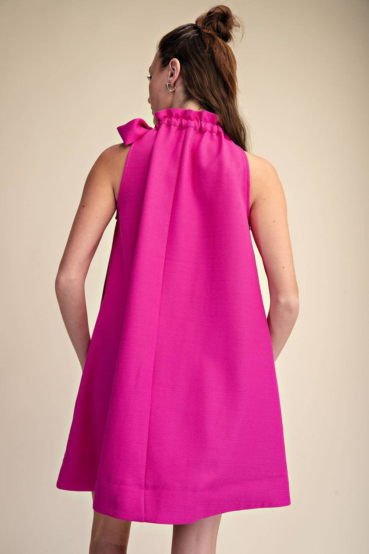 Magenta sleeveless mini dress with tie-front ruffle neckline and relaxed fit