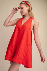 Red sleeveless V-neck flare romper with side pockets, perfect for Fourth of July, summer BBQs, and festivals