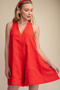 Red sleeveless V-neck flare romper with side pockets, perfect for Fourth of July, summer BBQs, and festivals