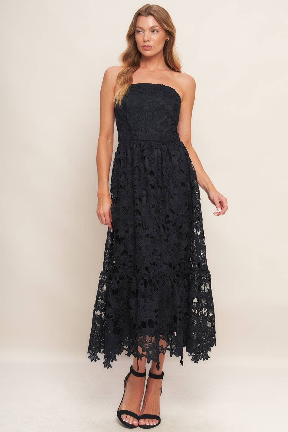 Black woven lace midi dress with straight neckline, ruffled hemline, and back zipper closure
