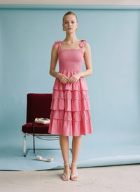 Fuchsia tiered ruffle midi dress with smocked bodice, adjustable tie straps, and lightweight cotton fabric