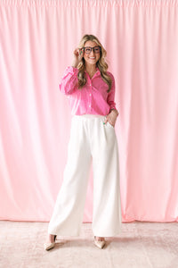 White wide leg knit pants with stretchy waistband and pockets — front view