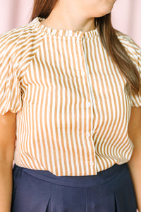 Tan and white striped puff sleeve blouse with button front placket and ruffle mock neck detail