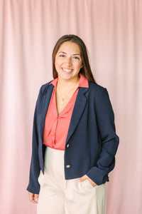 Naked Zebra Berry Blouse layered under navy blazer with cream wide-leg trousers — polished women's workwear outfit
