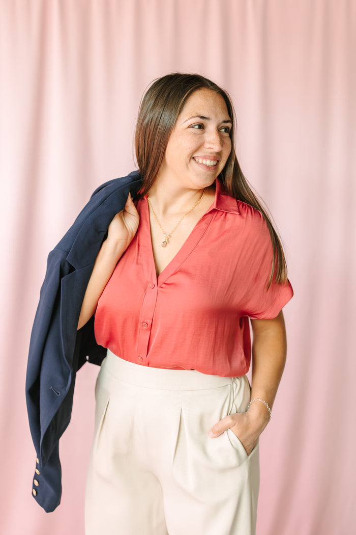 Women's Berry Short Sleeve Blouse by Naked Zebra styled with cream wide-leg trousers and navy blazer — contemporary office look
