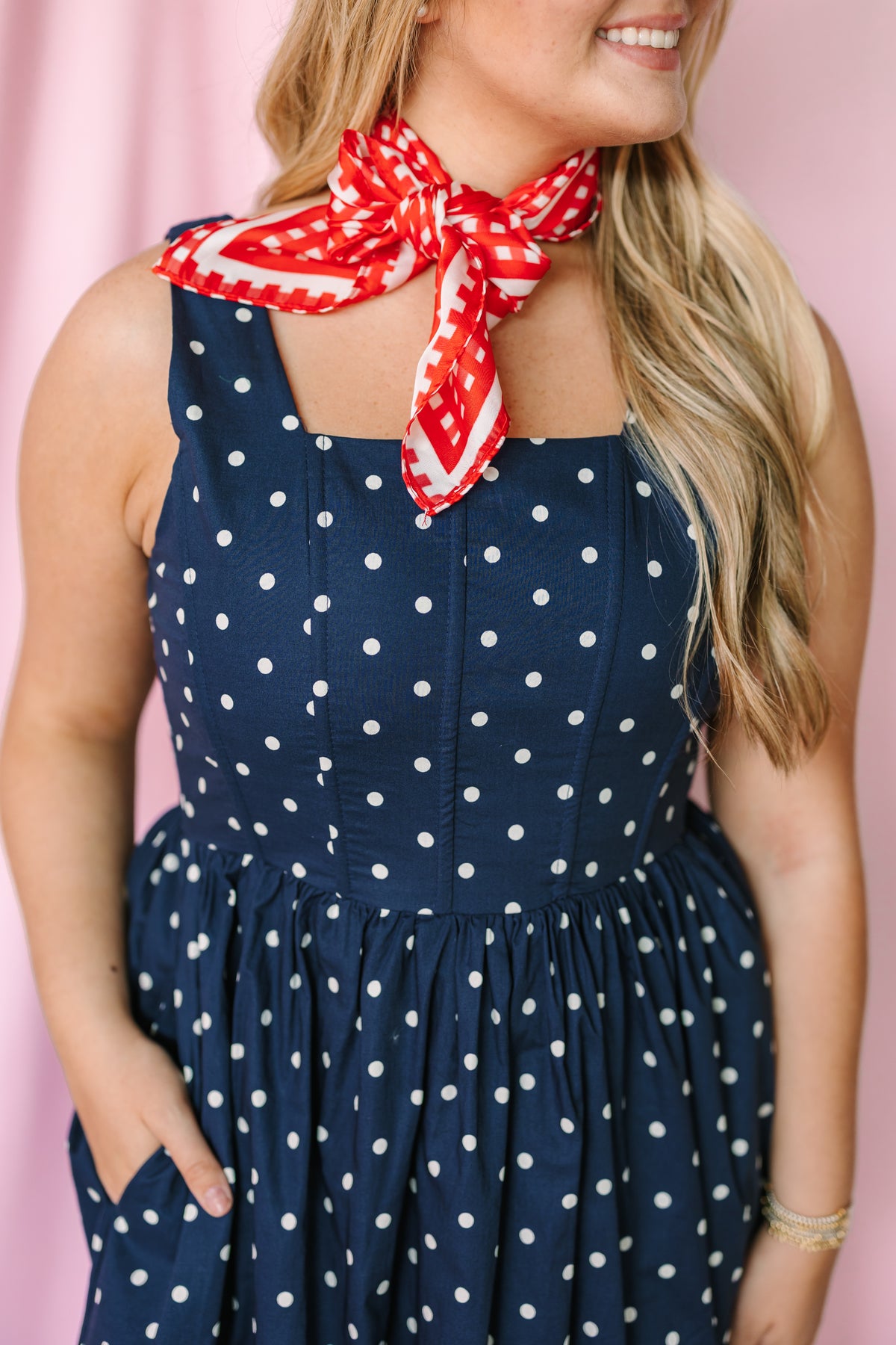 Navy polka dot midi dress detail view showing cotton fabric and pocket