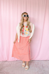 Women's pink nautical graphic tee, styled view with beach-inspired design