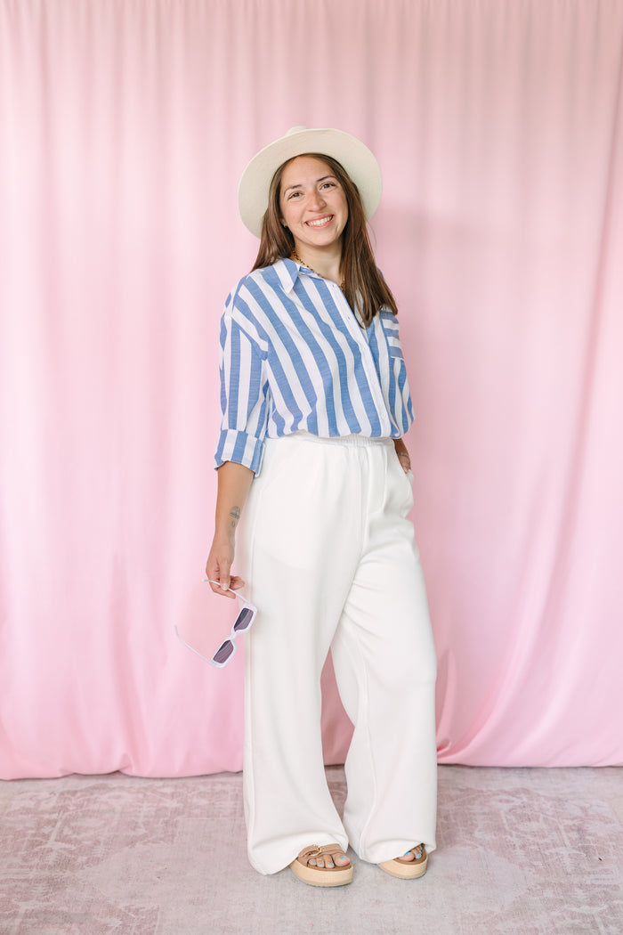White wide leg pants with soft knit fabric and relaxed silhouette 