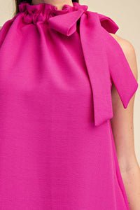 Magenta sleeveless mini dress with tie-front ruffle neckline and relaxed fit