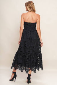 Black woven lace midi dress with straight neckline, ruffled hemline, and back zipper closure