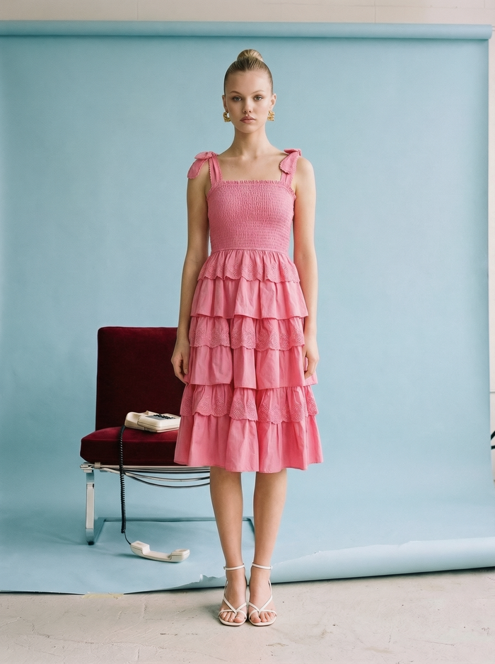 Fuchsia tiered ruffle midi dress with smocked bodice, adjustable tie straps, and lightweight cotton fabric