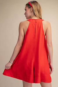 Red sleeveless V-neck flare romper with side pockets, perfect for Fourth of July, summer BBQs, and festivals