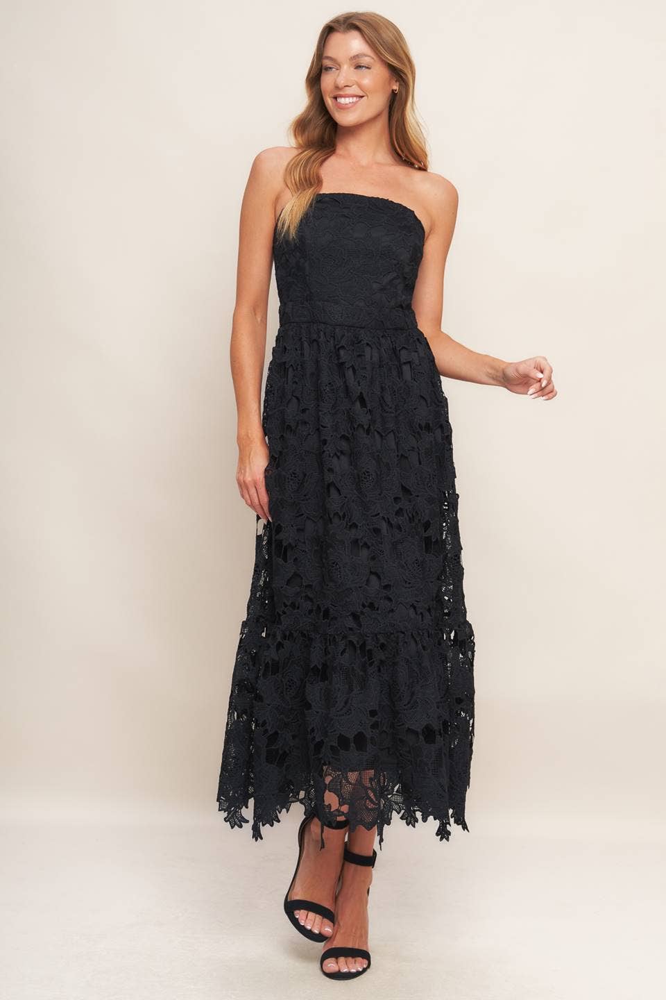 Black woven lace midi dress with straight neckline, ruffled hemline, and back zipper closure